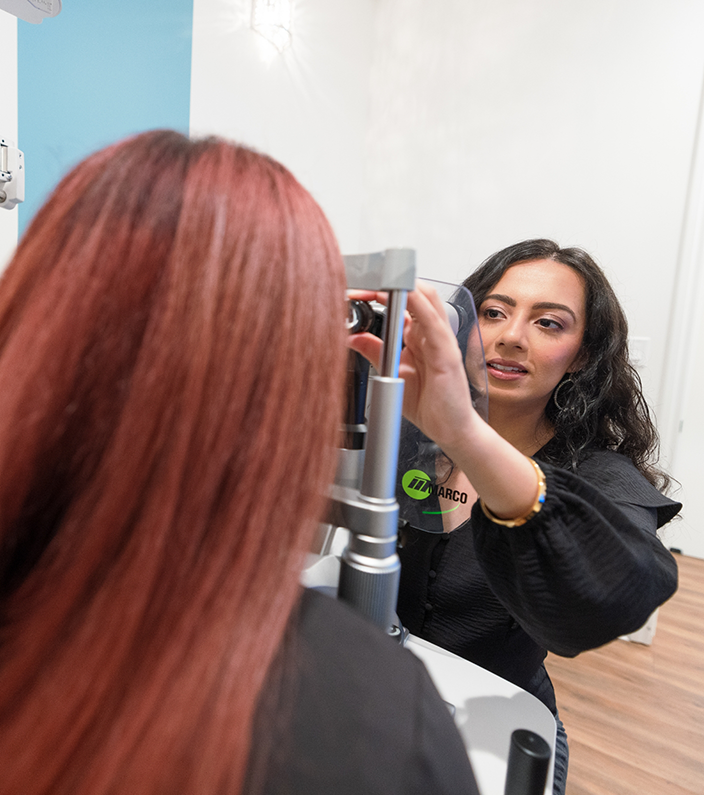 Doctor Z performing an eye exam on a patient