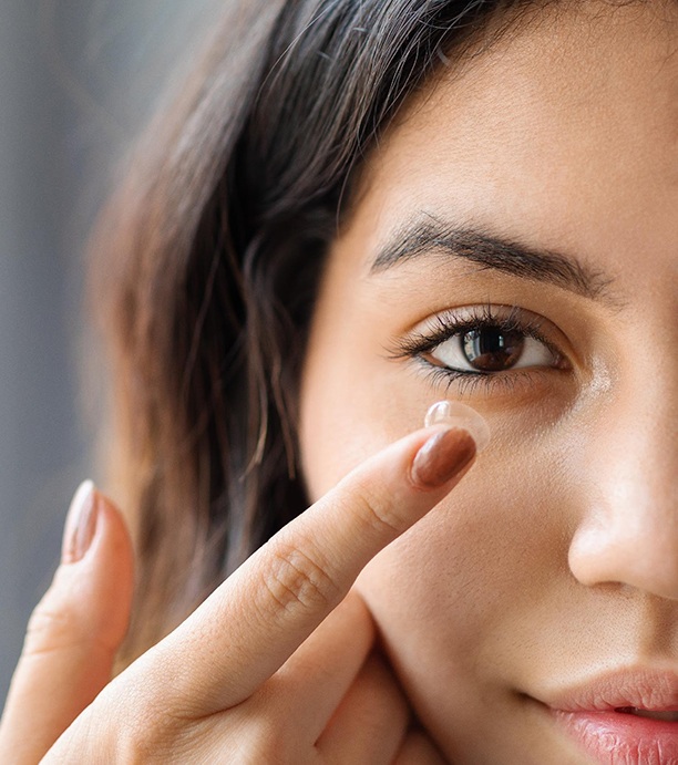 Woman about to put in contact lens