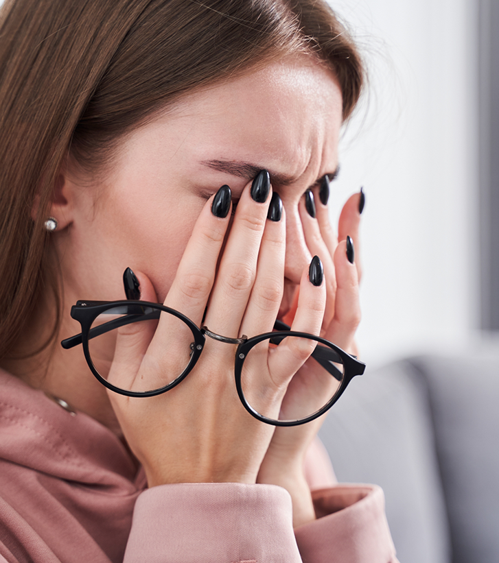 Woman rubbing her eyes