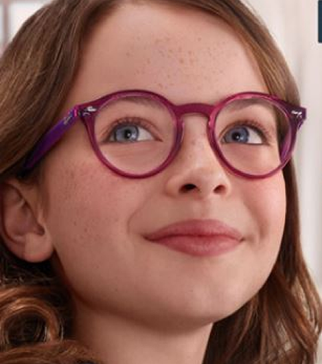 Young girl wearing round glasses with light pink frames