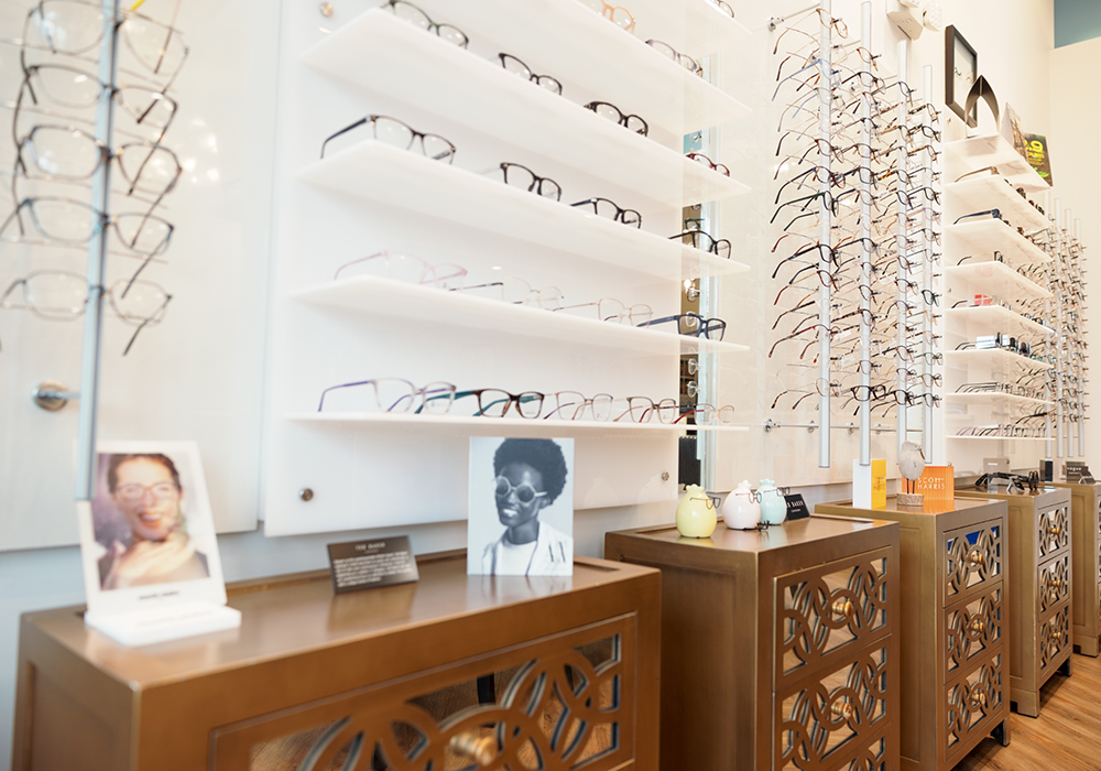 Several display shelves filled with eyeglasses