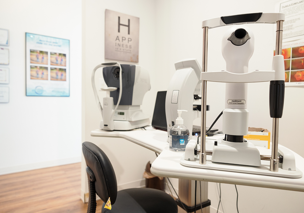 Pristine white desk with eye exam equipment