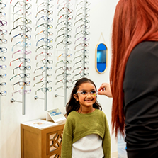 Young girl smiling at her optometrist