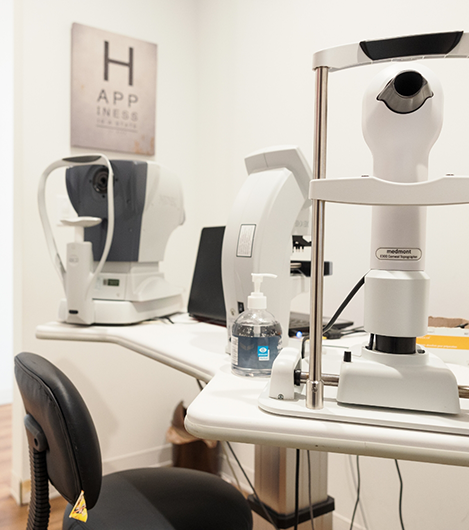 Pristine white desk with eye exam equipment