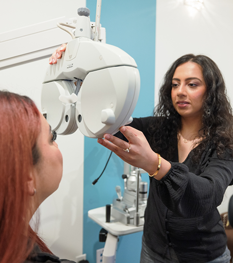 Doctor Z adjusting an eye exam machine