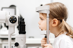 Little girl having a vision test performed